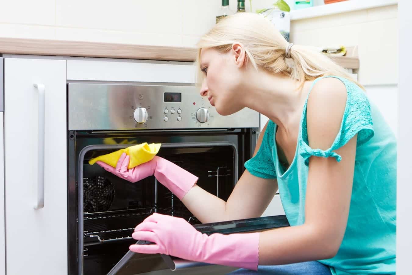 woman-cleaning-over-in-pink-gloves