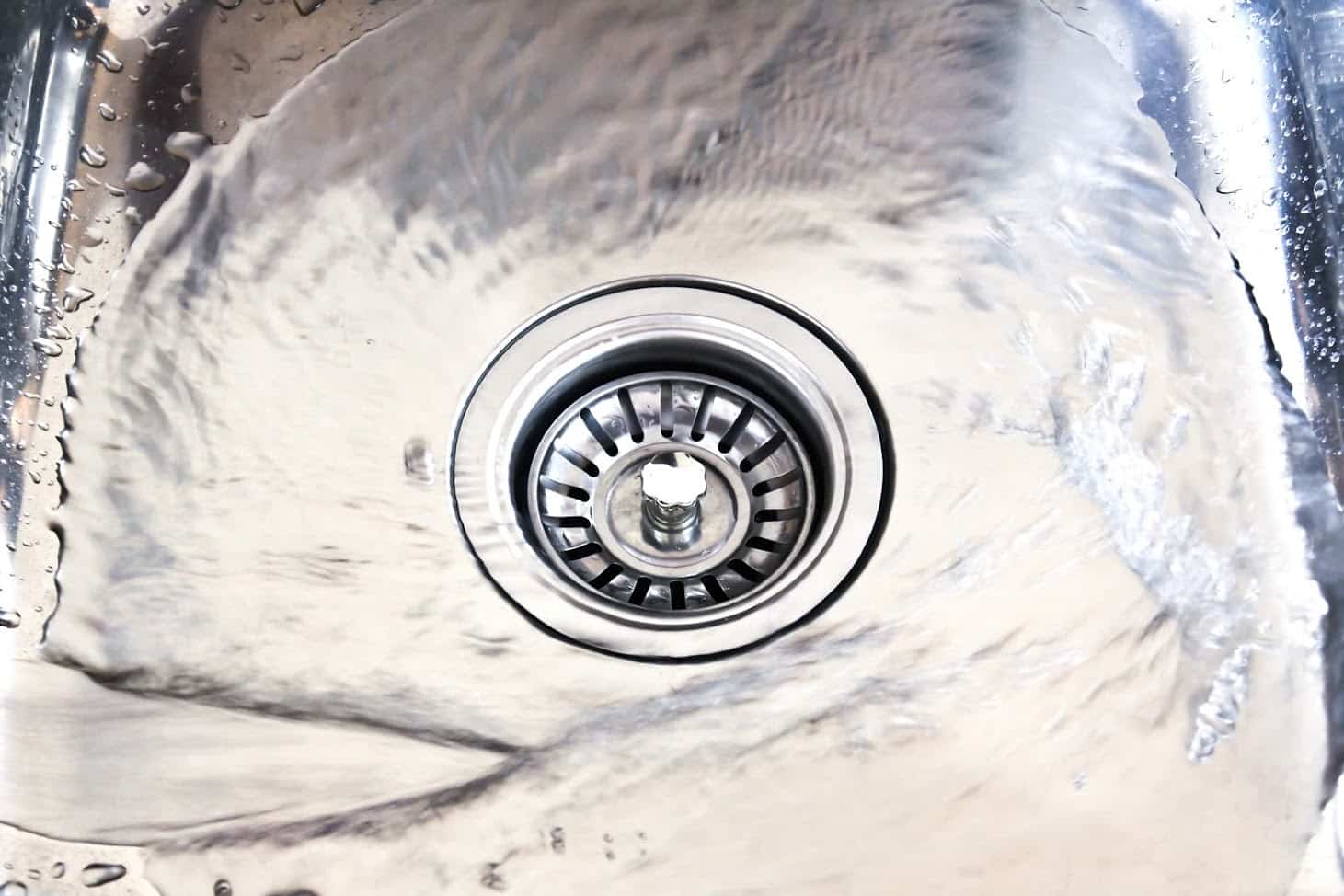 water-flowing-into-kitchen-drain