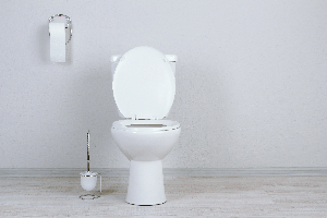 white-toilet-in-an-empty-room